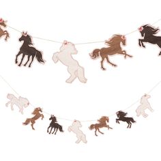 an image of a garland with horses hanging from it's sides on a string