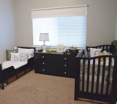 a baby's room with two cribs and a dresser