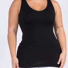 This Seamless Tank Makes Styling Any Outfit A Breeze! Featuring A V-Neckline And Fitted Silhouette In A Buttery, Soft Fabric That's Very Comfortable For Wearing All Day. Wide Shoulder Straps V-Neckline Back Scoop Neck Fitted Silhouette Seamless Design Buttery Soft Fabrication With Stretch Pull On/Off Longline Hem 92% Nylon, 8% Spandex Black Seamless Tops With Built-in Bra, Black Tops With Built-in Bra And Seamless Fabric, Black Seamless Tank Top With Built-in Bra, Black Stretch Seamless Tank Top, Black Stretch Camisole With Built-in Bra, Black Camisole With Built-in Bra For Layering, Black Seamless Construction Shapewear Top, Solid Racerback Seamless Camisole, Seamless Stretch Racerback Camisole