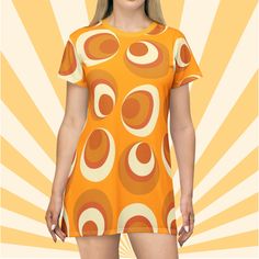 Mini dress groovy gift for her funky circle print with mod mustard color gift idea hippie T shirt party dress for summer gift idea for her. Looking for that dress that makes you stand out in a crowd, then this cute retro mini dress is for you! Show them your flair for fun and look good doing it in this fun, mod, 60's inspired Boho dress!! Be sure to check out all the fun styles available. https://www.etsy.com/shop/LuluandSamCo This All-Over-Print T-Shirt Dress is tagless, custom cut and sewn to Retro Dress With Orange Retro Print, Orange Retro Print Summer Dress, Orange Retro Dress With Retro Print, Yellow Short Sleeve Dress With Graphic Print, Yellow Short Sleeve Dresses With Graphic Print, Yellow Dress With Graphic Print And Short Sleeves, Orange Dress With Retro Print, Groovy Retro Print Summer Dress, Groovy Summer Dress With Retro Print