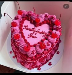 a heart shaped cake sitting on top of a white plate