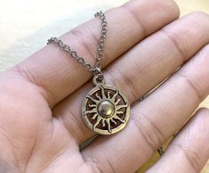 The sun, our beloved sun of the solar system, provider of all life! This necklace is ideal for anyone who loves the sun, anyone who is a fire element or is a Leo sun. Product Type, materials, and other details: 16” or 18” Stainless Steel Necklace with Stainless Steel lobster clasp. Sun charm in Antiqued Silver with zinc alloy materials about 1/2” in size. Product Type: Stainless steel necklaceHandcrafted in CT, USA. Free shipping in US within 2-5 business days. Gift Packaging included. window.da Sterling Silver Sun Necklace, Adjustable Metal Necklace With Sun And Moon Design, Adjustable Sun And Moon Metal Necklace, Adjustable Sun And Moon Necklace, Adjustable Sun And Moon Design Metal Necklace, Metal Sun Design Necklace As Gift, Adjustable Metal Necklace With Sun Design, Silver Sun Necklace With Sun And Moon Design, Silver Necklace With Sun And Moon Design