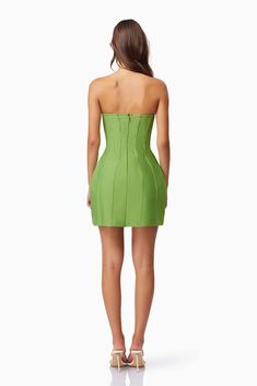 The Rose Mini Dress by Elliott is the perfect blend of flirty and fitted. The strapless design highlights your neckline, while the invisible back zipper allows for a seamless silhouette. The mini length adds a touch of playfulness to any occasion. 95% Polyester / 5% Spandex Dry Clean Only Rose Mini Dress, Strapless Neckline, Fern Green, Green Mini Dress, Cocktail Parties, Strapless Mini Dress, Fitted Silhouette, Classic Silhouette, Easy Wear