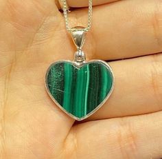 925 Sterling Silver Heart Necklace with Box Chain Malachite is an opaque stone that is a light green to deep green hue. It is found in a unique banded pattern. The bands are white and green and run in parallel streaks. This stone was discovered around 4,000 BC. Malachite translates from Greek to mean mallow, a green leafy herb. Malachite is believed to provide protection to travelers. It has been called the mirror of the soul, because it reflects the inner feelings of a person positive or negati Sterling Silver Jewelry With Heart Charm In Green, Green Heart Cut Necklace For Gift, Green Heart-shaped Jewelry Gift, Green Malachite Necklace For Gift, Green Sterling Silver Heart Jewelry, Green Heart-shaped Gemstone Necklace, Green Sterling Silver Heart-cut Jewelry, Green Heart-shaped Sterling Silver Jewelry, Green Heart-shaped Natural Stone Jewelry