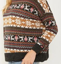 Keep cozy and stylish this winter with our lightweight turtleneck sweater. Its unique brown winter/holiday print adds a touch of whimsy to any outfit, making it the perfect seasonal must-have. Stay warm and make a statement with this playful sweater. Be holiday ready with this Fair Isle sweater! The pattern features reindeer and snowflakes in an alternating design, and the sweater has a turtleneck for extra warmth. Neckline: Turtleneck Length: Regular Sleeve length: Long sleeves Sleeve type: Dro Cozy Brown Turtleneck Top, Warm Brown Sweater For Fall, Warm Brown Knit Tops, Cozy Warm Brown Top, Brown Tops For Fall Cold Weather, Brown Tops For Cold Weather In Fall, Winter Brown Tops With Fair Isle Pattern, Casual Holiday Sweater For Fall, Casual Patterned Sweater For Winter