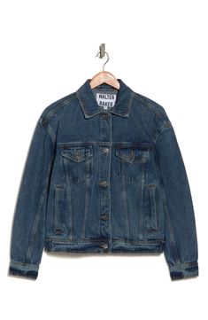 A classic denim jacket features vertical pockets at the front and button tabs at the hem for added detail. Spread collar 100% cotton Dry clean Imported Classic Denim Jacket With Buttoned Pockets And Relaxed Fit, Classic Medium Wash Outerwear With Flap Pockets, Classic Relaxed Fit Medium Wash Denim Jacket, Classic Relaxed Fit Denim Jacket With Patch Pockets, Classic Cotton Denim Jacket With Buttoned Pockets, Classic Denim Utility Jacket With Patch Pockets, Classic Spring Denim Jacket With Flap Pockets, Dark Wash Utility Denim Jacket For Everyday, Everyday Dark Wash Utility Denim Jacket