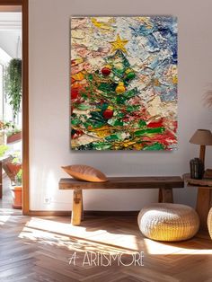 a painting is hanging on the wall next to a wooden bench in a living room