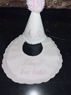 "These Fancy Bibs for baby boy or girl are perfect when dressing up for a birthday party!  The Scalloped Edge Cotton Fancy Bib has white fabric for the top and pink bottom layer, Velcro closure. This bib measures approximately 9\" wide x 9\" long and has a neck opening of approximately 3.75\" wide x 4\"  Embroidered in pink \"Today I Eat Cake!\" white Swiss dot hat with name embroidered in pink" Playful White Party Supplies For First Birthday, Fun White Birthday Party Supplies, White Fun Party Supplies For Birthday, Fun White Party Supplies For Birthday, Cute White Hat For First Birthday, Cute White Hat For Birthday, Playful White Hat For First Birthday, Cute White Party Supplies For Gifts, Cute White Party Supplies For Gift