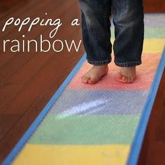 a child's feet standing on a rainbow rug with text overlay reading, stopping a rainbow