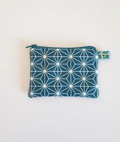 This mini clutch is coated on the outside and lined with a stiff linen fabric for a good hold. It can be used as a wallet but is also very practical for storing jewelry, transport or loyalty cards, etc. Dimensions: 12*9cm On order: shipped within 2 to 4 working days Modern Blue Bag For Gifts, Modern Blue Bags For Gifts, Modern Blue Bags As Gifts, Compact Blue Bags For Daily Use, Modern Blue Rectangular Pouch, Blue Zipper Pouch For Daily Use, Blue Rectangular Pouch For Daily Use, Blue Pouch Bag With Card Slots, Rectangular Blue Pouch For Daily Use