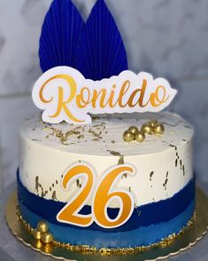 a cake with the number 26 on it and a sign that says rondido