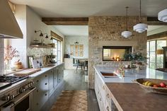 a kitchen with an oven, sink and counter tops in it's center island