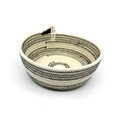 a black and white basket with handles