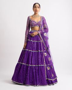 Intricately hand embroidered multi color sweetheart blouse with multi tier hand embroidered lehenga and a beautiful mirror work dupatta.From Vvani Vats Rang's collection.DELIVERY TIMEPlease allow 8-12 weeks for your outfit to arrive.FABRIC DETAILSNet, Georgette, Silk BlendProfessional cleaning only. Multi Color Lehenga, Mirror Work Dupatta, Sweetheart Blouse, Vani Vats, Purple Lehenga, Lehenga Dupatta, Organza Lehenga, Net Blouses, Georgette Dupatta