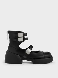 Our new seasonal take on classic ankle boots is both cool and modern. These shoes feature chunky soles that create a striking silhouette, paired with edgy buckled straps. The high-top design adds an extra chic element, making them stand out despite their simple black finish. They also include zippers at the back for easy wear, allowing you to slip in and out effortlessly, ensuring you look stylish even on the busiest days. Ankle-high Platform Boots With Buckle Punk Style, Ankle-high Platform Boots With Buckle Closure Punk Style, Leather Platform Boots For Streetwear With Buckle Closure, Trendy Streetwear Platform Boots With Buckle Closure, Modern Boots With Buckle Closure And Round Toe, Modern Chunky Platform Boots, Trendy High Ankle Platform Boots With Buckle Closure, Trendy High Ankle Platform Boots With Buckle, Edgy High-top Platform Boots With Buckle Closure