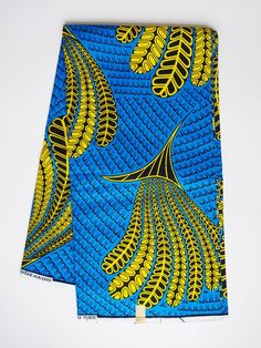 Bright Blue yellow African fabric by the Yard Ankara fabric by the yard sewing fabric African print fabric wax print cotton african materialAfrican fabric Wax print fabric by the yard. This beautiful African wax print fabric, also known as Ankara, is ideal for making unique clothing items, eye-catching home décor projects, amazing accessories, and many other projects.Sold by the yard.100% cotton, 46" inch wide.If you purchase multiple units of this fabric, it will be sent as one continuous piece Blue Printed Ankara Fabric, African Textiles Patterns, Blue Ankara Print Fabrics, Yellow Ankara Fabric With Traditional Patterns, Blue Ankara Fabric With Unique Pattern, Yellow Printed Ankara Fabric, Ankara Fabric With Geometric Pattern Prints, Printed Orange Ankara Fabric, Printed Yellow Ankara Fabric