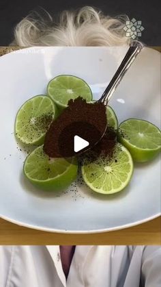 a white plate topped with sliced limes and chocolate