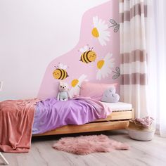 a child's bedroom with pink walls and bedding, stuffed animals and flowers