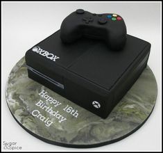 a birthday cake made to look like a video game controller