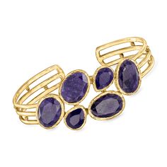 Ross-Simons - 30.00ct t. w. Sapphire Cuff Bracelet in 18kt Yellow Gold Over Sterling. 7". Embrace a unique look for a classic gem, as 30.00 ct. t. w. oval and pear-shaped sapphires create an artful scattering across the wrist in polished 18kt yellow gold over sterling silver. Textured and polished finishes. 1" wide. Slip-on, sapphire cuff bracelet. Sapphire birthstones are the perfect gift for September birthdays. Adjustable Gemstone Bangle For Formal Occasions, Formal Gemstone Cuff Bracelet In Bangle Shape, Formal Gemstone Bangle Cuff Bracelet, Stackable Cuff Bracelet For Formal Occasions, Formal Fine Jewelry Cuff Bracelet With Gemstone, Fine Jewelry Gemstone Cuff Bracelet For Formal Occasions, Modern Gemstone Cuff Bracelet For Formal Occasions, Formal Gemstone Cuff Bracelet, Formal Yellow Gold Cuff Bracelet With Gemstone