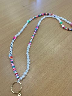 Beaded lanyard with multicolor beads and pearls with flowers! Can be customized or not. Lanyard Diy, Diy Lanyard, Beaded Lanyard, Beaded Lanyards, Material Textures, Craft Jewelry, Kissimmee, Phone Charm, Badge Holders Lanyard