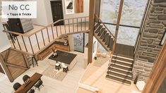 an aerial view of a living room and dining area with stairs leading up to the second floor