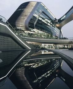 an image of a building that is reflecting in the water