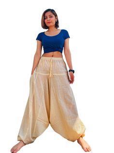 You are viewing boho/ hippy/festival, a pair of Aladdin Harem trousers.  Features:     ✔Elastic fitted waist and ankle which make it suitable for most of the adult sizes     ✔Elasticated Waist: 26-38 Inches(will fit any size in between)    ✔ Length: 39-40 Inches((will fit any length in between))     ✔Material: Upto 60% organic hemp + 40 % cotton fiber applied loom fabric     ✔Quality: Relatively strong, yet soft fabric      ✔Drawstring waist     ✔Two side pockets ☑Hemp Fabric/Fiber is sustainabl White Bohemian Harem Pants, White Bohemian Full Length Bottoms, White Full-length Bohemian Bottoms, White Bohemian Cotton Harem Pants, Traditional White Wide Leg Bottoms, Traditional Summer Festival Bottoms, Traditional Style Baggy Pants For Spring, Traditional Baggy Pants For Spring, Bohemian Wide-leg Parachute Pants For Spring