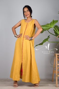 "Women Cotton dress, a Sleeveless yellow boho dress with split long Sundress loose Robes casual Shirt Dress with pockets PRODUCT SIZE : One Size * Chest : max 38\" * Waist : max 40\" * Hips : up to 52\" * Length : 52 from shoulder to hem * Armhole : 20\" * Shoulder to shoulder : 13 NOTE : * Model chest : 32\", waist : 24\" hips : 35\" * Combined Height is 5\"6 > I'm 5\"2 (158cm) and I'm wearing 4\" heels in the pictures MATERIAL * Cotton (does not stretch) * Accessories excluded * As this is a s Casual Long Dresses With Side Slits, Bohemian Floor-length Dress With Side Slits, Bohemian Sleeveless Maxi Dress With Back Tassel Tie-up, Bohemian Floor-length Maxi Dress With Side Slits, Sleeveless Summer Dress With Back Tassel Tie-up, Yellow Cotton Sleeveless Vacation Dress, Casual Cotton Maxi Dress With Side Slits, Cotton Maxi Dress With Side Slits, Long Maxi Dress With Tassels