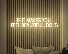 a neon sign that says if it makes you feel beautiful, do it on the wall