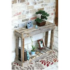 a wooden table with books and plants on it