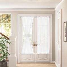 the interior of a house with white walls and wooden floors