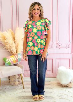 IN A GARDEN STATE OF MIND! Green w/ Pink, Orange & Yellow Florals Boat Neckline | Short Ruffled Sleeves | Curved Hemline Woven | No Stretch | Relaxed Fit Main: 100% Polyester Measurements Bust Measured Laid Flat Across Front | Armpit to Armpit S 20” | M 21” | L 22” | 1XL 23” | 2XL 24” | 3XL 25” Length Measured Shoulder to Hemline S 27” | M 27” | L 28” | 1XL 28” | 2XL 29” | 3XL 30” Model: Holly is wearing a Small Brand: First Love Green Vibrant Print Summer Blouse, Summer Green Blouse With Vibrant Print, Summer Blouse With Vibrant Green Print, Trendy Green Blouse With Vibrant Print, Summer Green Floral Print Blouse, Green Floral Print Summer Blouse, Spring Green Floral Print Blouse, Spring Floral Print Green Blouse, Green Floral Print Blouse For Spring