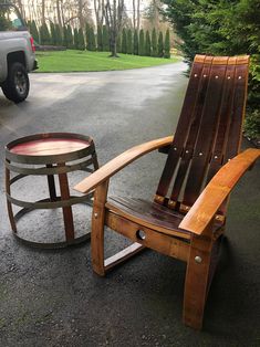 a wooden chair sitting on top of a parking lot