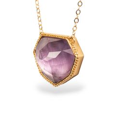 This exquisite necklace features an Amethyst in a unique, geometric shape. A beautiful, violet hue glows beneath a faceted surface. We honored this stone by encasing it in a handmade 18k gold bezel. Technical Details Metal: 18k yellow goldAmethyst: 17.98 cts. Pendant Size: 17.5 x 20.5mmChain: can be worn at 16" and 18"Closure: lobster claspHandmade in New YorkStyle # N-3325-AM Luxury Amethyst Birthstone Necklace, Fine Jewelry Amethyst Necklaces In Yellow Gold, Fine Jewelry Yellow Gold Amethyst Necklaces, Fine Jewelry Amethyst Necklace In Yellow Gold, Luxury Amethyst Pendant Necklace, Formal Faceted Amethyst Jewelry, Yellow Gold Amethyst Briolette Jewelry, Yellow Gold Briolette Amethyst Jewelry, Luxury Yellow Gold Amethyst Necklace