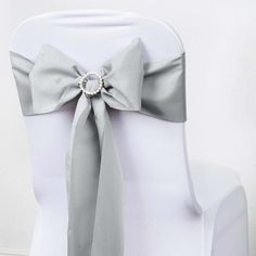 Quantity: 5 Chair Sashes Material: Polyester Color: Silver Size: 6"W x 108"L Thickness: 150 GSM Edges are serged to form an elegant look when tied into bow form. Buy Sash Buckles InformationAdditional Information: Each order is for 5 sashes. Sashes are shipped untied. How to Care: Machine washable, cold water, gentle cycle For sashes only, does not include any other decorations Uses: Wedding, Party, Event, Banquet, Decoration - 5 Pack Silver Polyester Chair Sashes 6"x108" - Weddings, Events By e Chair Bows, Chair Ties, Chair Sash, Bow Sash, Chair Sashes, Bow Tie Wedding, Theme Color, Beautiful Centerpieces, Silver Lights