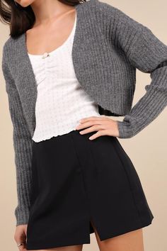 Layering just got a little more adorable, thanks to the Lulus Comfy Cuteness Grey Heathered Ribbed Knit Shrug Cardigan! Soft and stretchy ribbed knit, with a subtle heathered effect, shapes long fitted sleeves and a shrug-inspired bodice with an open front and cropped, rounded hems. Add your favorite mini skirt and tights for a fall-approved look! Fit: This garment fits true to size. Length: Size medium measures 16.75" from shoulder to hem. Bust: Great for any cup size. Waist: Not Fitted - comfo Trendy Fitted Ribbed Cardigan, Stretchy Ribbed Knit Outerwear, Fitted Knitted Shrug For Fall, Trendy Shrug For Layering, Gray Ribbed Cardigan For Fall, Trendy Knit Shrug For Layering, Winter Fitted Ribbed Cardigan, Casual Stretch Winter Shrug, Casual Winter Stretch Shrug