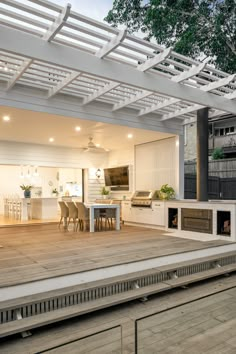 an outdoor kitchen and dining area is shown