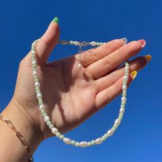 "The Avocado necklace is beautifully designed with real emerald stones and freshwater pearls! It is delicately handmade as a choker style. It includes a gold-filled spring ring lock and a gold-filled one inch extension that makes it adjustable from 15\" - 16\". Complete your summer look with this, or gift this to a loved one! Only 2 are made!" Avocado Necklace, Choker Style, Emerald Stone, One Inch, Beaded Necklaces, Summer Look, Spring Rings, Summer Looks, Freshwater Pearls