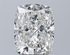 a cushion cut diamond on a gray background