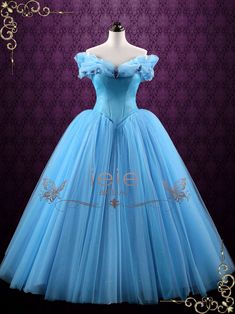 "Cinderella" is our latest creation based on the movie Cinderella 2015. You will feel like an enchanted princess in this magical ball gown, the sparkly tulle and crystal rhinestones sprinkled over the skirt will shine and glitter under lights. Can also be made in white for debutante balls and weddings. Working Time: 8-10 weeks Rush Order please inquire prior to order. Custom Designs We specialize in custom design services.If there's a dress you like and it's not on our website,you're more than w Disney Princess Inspired Dresses, Cinderella Ball, Enchanted Princess, Cinderella Blue, Blue Ball Gown, Cinderella Movie, Cinderella 2015, Debutante Ball, Blue Ball Gowns