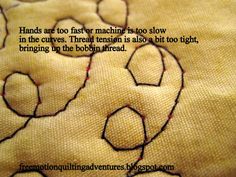 a close up of a piece of cloth with stitching on it and the words hands are too fast machine is too slow in the curves