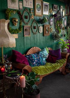 a living room filled with lots of green furniture