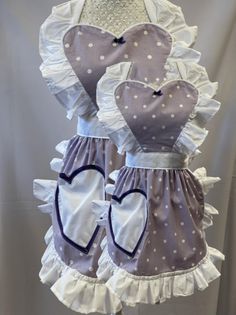 two aprons made to look like hearts with ruffles and polka dots on them