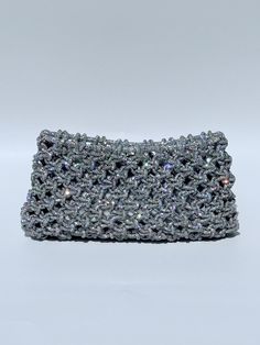 THE CLUTCH Our Crystal Rhinestone Clutch is handwoven in thousands of beautiful pavé crystal rhinestones for maximum sparkle.  An amazing statement piece.   Once in the sun or lights, stunning gives way to EPIC sparkles! Beautiful for a wedding be it for the bride, bridesmaids or guests.  DETAILS: *Dimensions (approximate, each are hand made): - 9 inches wide - 5 inches tall *Interior magnetic clasp. Contact us for specific measurements and custom options. All handbags and clutches are handmade Luxury Rectangular Shoulder Bag For Reception, Glamorous Rectangular Bags For Reception, Luxury Rhinestone Bags For Reception, Luxury Pouch Evening Bag For Receptions, Elegant Rectangular Shoulder Bag For Reception, Crystal Embellished Clutch For Reception, Silver Rectangular Evening Bag For Reception, Silver Clutch Evening Bag For Reception, Silver Clutch For Reception