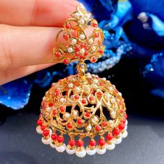 Featuring a big jhumka earrings studded with real pearls and coral look alike stones. These large domed jhumka will make a statement everytime and anywhere you wear them to The earrings close with a bombay screw and come with a french clip for ease of wear. Coral Jhumkas Gold, Big Jhumka Earrings, 22k Gold Jewelry Necklaces, Jumka Earrings, Indian Jhumka, Coral Jewellery, Gold Earrings For Kids, 22k Gold Jewelry, Gold Bridal Jewellery Sets