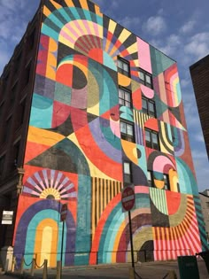 a large colorful building painted on the side of it