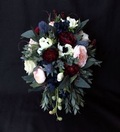 a bouquet of flowers on a black background