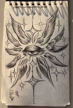 a drawing of an eye with wings and stars