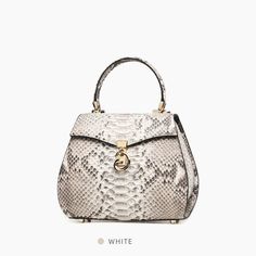 The Maison's dark elegance is the key feature of this genuine python bag with rotating metal closure on the top flap. It has a detachable metal shoulder strap. The inside is fully lined and features a mirror and a ""You look great today"" embroidery. You will not find two bags the same due to the natures of the exotic genuine leather and their differences among different animals. Measures: h cm 12, w cm 24, d cm 9.[custom tab]SHELL #1: 100% PYTHON LEATHER | INTERNAL INSERT 1#: 100% CALF LEATHER Elegant Leather Bag With Snake Print, Elegant Leather Snake Print Bags, Elegant Snake Print Leather Bags, Luxury Evening Bag With Snake Print, Luxury Snake Print Evening Bag, Luxury Snake Print Shoulder Bag For Evening, Elegant Snake Print Shoulder Bag, Elegant Snake Print Evening Bag, Elegant Formal Snake Print Bag